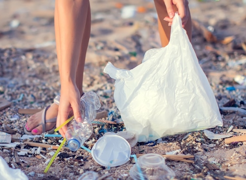 Plastic straws and plastic litter on beach